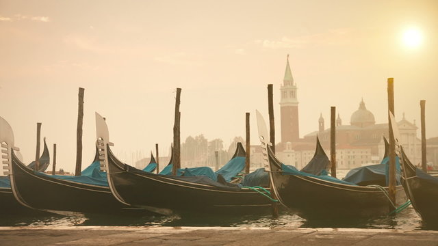 Venetian gondolas tied near the pier on San Marco square