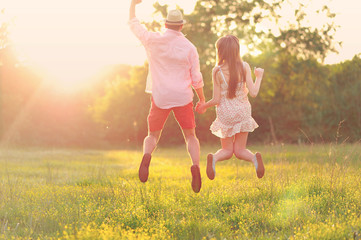 young couple in love having fun, take photos and enjoying in the beautiful nature