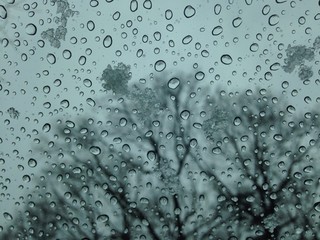ice droplets and snow at window