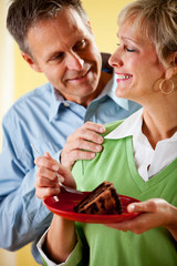 Couple: Eating a Piece of Chocolate Cake