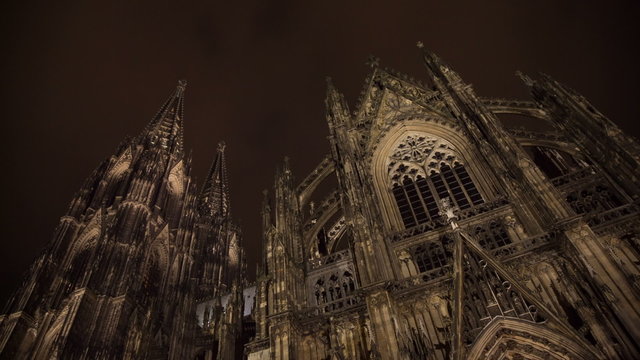 Cathedral in Cologne with clouds and sky at night