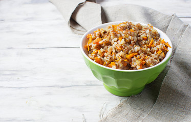 Buckwheat with carrots in light background