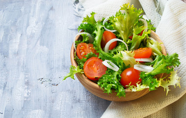 Fresh salad with tomato, frisee and onion