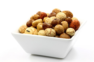 japanese nuts in a white bowl on a white background