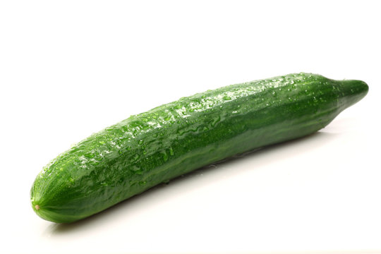 whole fresh cucumber on a white background
