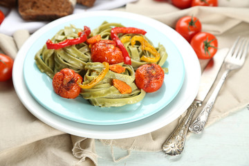 Tasty pasta with pepper, carrot and tomatoes