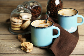 Beautiful composition with tasty cappuccino on wooden table