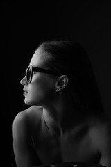 Profile of a beautiful woman wearing stylish eyeglasses