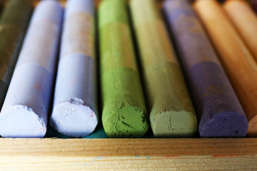 Colorful chalk pastels in box close up