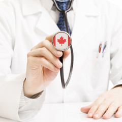 Doctor holding stethoscope with flag series - Canada