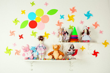 Shelves with toys in child room close-up