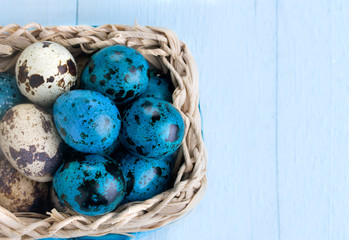 Colorful easter eggs in white basket