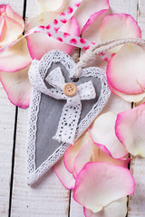 Decorative heart on rose petals
