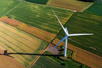 Wind turbine on a field, aerial photo