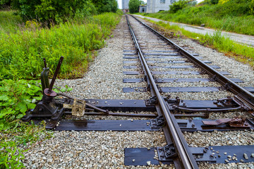 Manual railroad switch on old plant