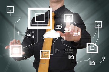 Businessman works on huge tech screen