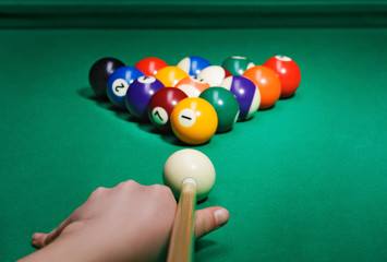 Pool game balls against a green