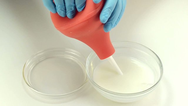 Enema is filling with white liquid