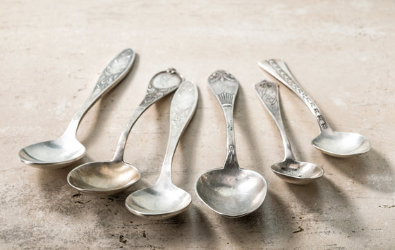 Various Empty Silver Spoons