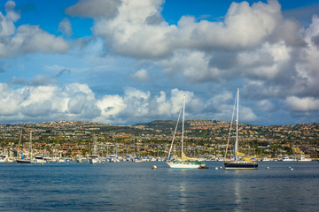 Boats and view of hills across Beacon Bay, from Newport Beach, C