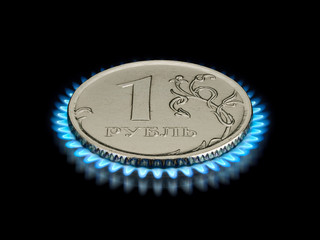 Coin advantage in one ruble on a gas flame