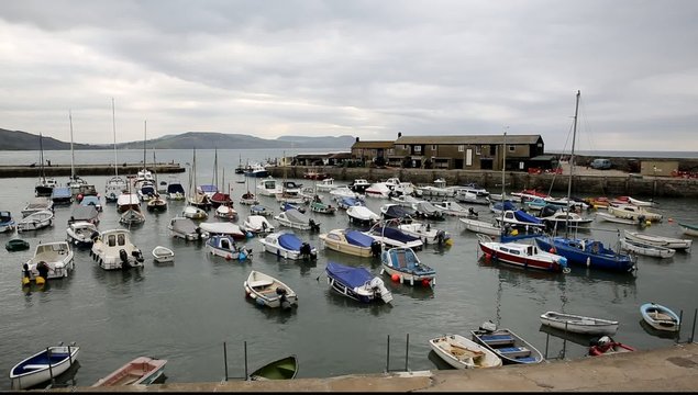 Boats in Lyme Regis harbour Dorset UK