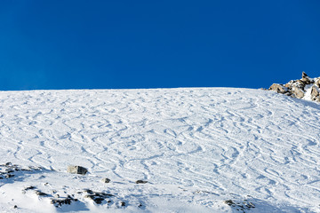 Fototapeta na wymiar Off piste ski tracks on powder snow