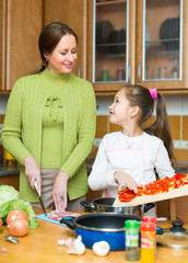 girl and mom with vegetables