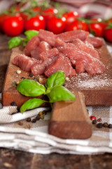 Igredients for beef stew on wooden board