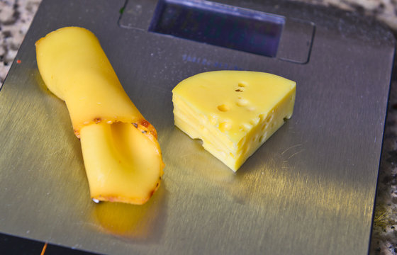 large chunks of cheese on the scales closeup .