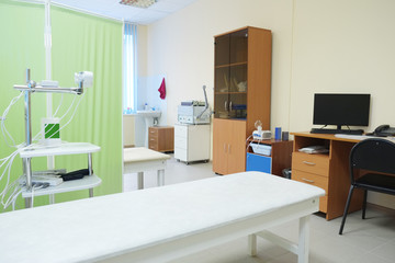 The image of an empty treatment room. Magnetic therapy device