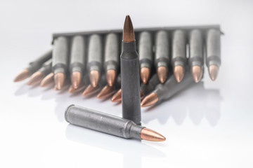 ar15 m16 m4 kalashnikov cartridges with ammo clip isolated on wh