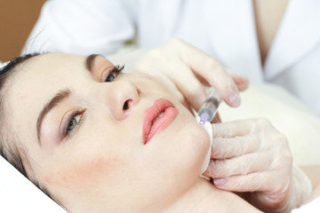 Obraz na płótnie Canvas Woman Having Botox Treatment At Beauty Clinic