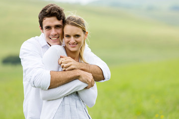 young couple portrait on grassland