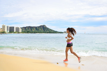 Fototapeta na wymiar Woman runner - running fitness girl beach jogging