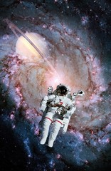 Obraz na płótnie Canvas Astronaut Spaceman Saturn Spiral