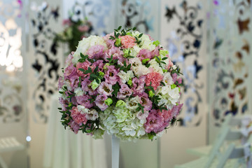 Festive bouquet of flowers at the wedding table decoration