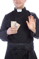 The young priest holding a lot of money in hand