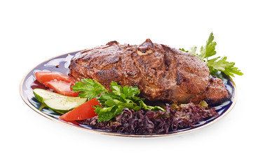 Meat on a grill with vegetables