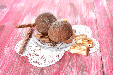 Cupcake with chocolate on wooden background