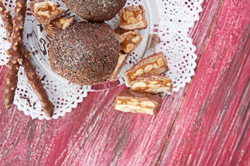 Cupcake with chocolate on wooden background