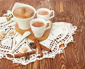 tea with sugar cubes on wooden