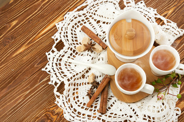 tea with sugar cubes on wooden