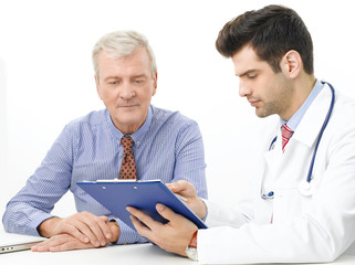 Young male doctor with elderly patient