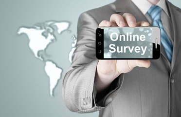 Businessman showing business concept on smartphone  - Online