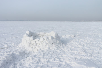 Unfinished snow construction of igloo