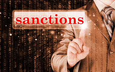 businessman pressing sanctions button on virtual screens