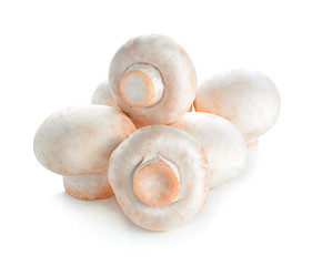 Heap of champignon mushrooms. Isolated on white background