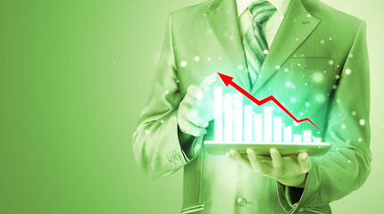 business man using tablet computer to work with financial data