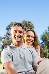 Happy couple relaxing in the park